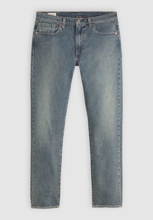 Jeans de denim azul clásico con un diseño de pierna recta. Cuenta con cinco bolsillos, remaches de metal y cierre de cremallera. Acabado desgastado, lavado medio.