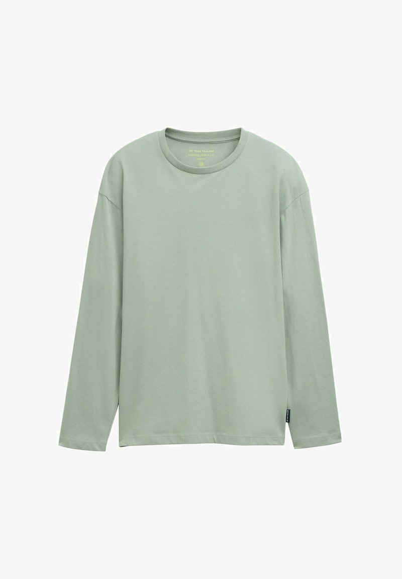 Šviesiai žalia ilgomis rankovėmis marškinėliai, pagaminti iš švelnaus medvilnės, su apvaliu kaklu ir laisvu kirpimu, su etikete apatinėje pusėje.