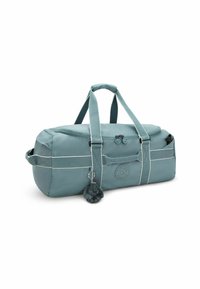 Sac de sport teal avec deux poignées, compartiment principal zippé, poches latérales et un petit porte-clés en peluche en forme de singe attaché.