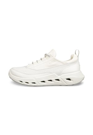 White athletic shoes with a smooth, textured upper, featuring a padded collar, reflective accents, and a cut-out sole for airflow.