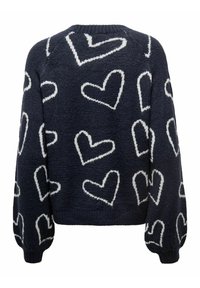 Marinblå stickad tröja med vita hjärt-mönster. Har raglanärmar och ribbade muddar. Mjuk textur, kort design.