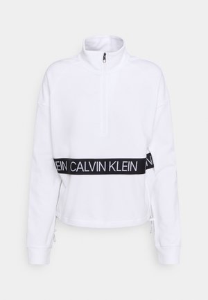 Biały sweter z długim rękawem, z półzamkiem i czarnym paskiem na talii z logo Calvin Klein w białych literach.