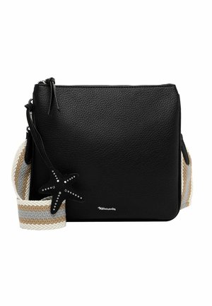 Black textured leather crossbody bag with wide beige and gray striped fabric strap, star-shaped black charm with metal studs, and top zipper closure.