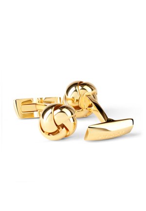 Gold-tone cufflinks featuring a knot design and a bar fastening. Smooth, shiny finish with engraved branding on one link.