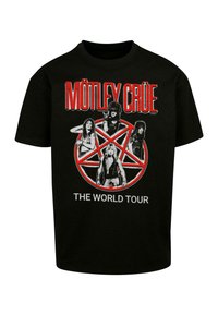 Sort bomulds t-shirt med et centralt grafisk motiv af fire figurer og et rødt pentagram, med teksten "MÖTLEY CRÜE" og "THE WORLD TOUR".