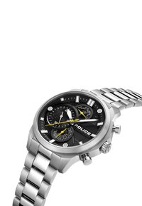 Srebrna ura iz nerjavečega jekla z črnim številčnico, rumenimi akcenti, tremi podštevci in dizajnom zapestnice s povezavami. Ima funkcijo kronografa.