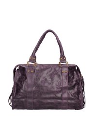Sac en cuir violet avec une surface texturée, des poignées doubles, des finitions en métal doré et des glands sur les côtés pour un détail supplémentaire. Fermeture éclair sur le dessus.