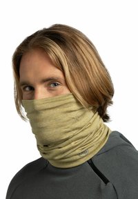 Beige neck gaiter made of soft fabric, featuring a smooth texture and subtle heathered pattern, worn with a gray fleece top.