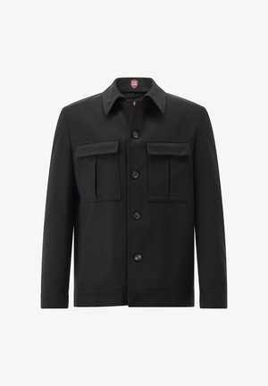 Black jacket with a pointed collar, front button closure, two chest pockets, and long sleeves. Made from smooth fabric.