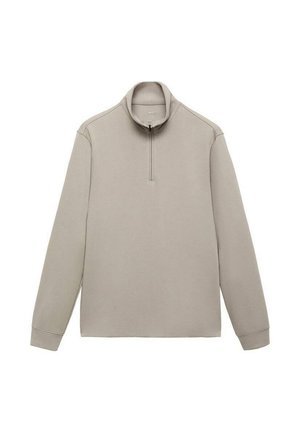 Pulóver beige con cuello de cremallera a cuarto, mangas largas y una textura suave. Diseño minimalista, sin patrones ni acentos visibles.