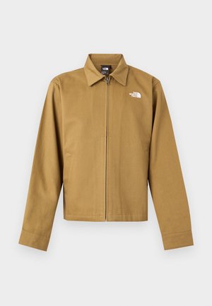 Muška svijetlosmeđa jakna na patent s ovratnikom, dugim rukavima, bočnim džepovima i bijelim logotipom The North Face na prsima.