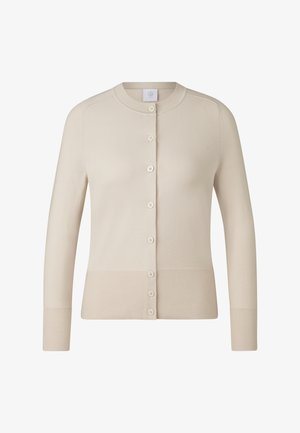 Beige vest gemaakt van zachte stof, met een ronde hals, lange mouwen en zes knopen aan de voorkant, met geribbelde boorden en zoom.