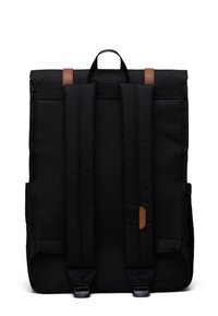 Black fabric backpack with two brown leather accents, adjustable padded straps, and a top handle; rectangular shape with a smooth texture.