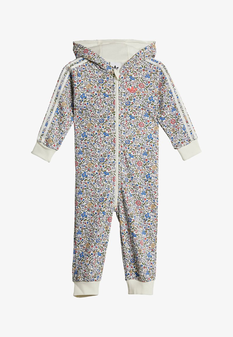 Gėlių rašto gobtuvu kombinezonas kreminės, mėlynos, raudonos ir geltonos spalvų atspalviuose su priekiniais užtrauktukais, raštuotomis rankovėmis ir baltais šoniais.