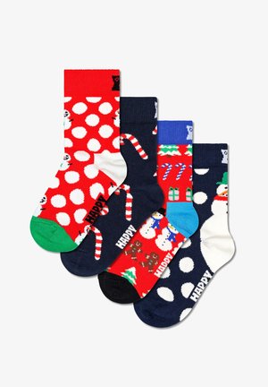 Čtyři páry svátečních ponožek: červené s bílými puntíky, tmavě modré se sladkostmi a vzory sněhuláků a dárků v živých barvách.