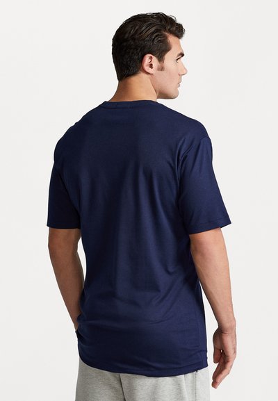 Navy blue cotton t-shirt with short sleeves, relaxed fit, crew neck, and smooth texture, viewed from the back.