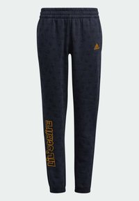 Marineblaue Sweatpants mit elastischem Bund, mit einem dezenten Muster und orangefarbenem "Lil' Stripes"-Text am linken Bein.