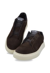 Suede brown slip-on shoes with elastic straps, rounded toe, and cream rubber sole. Features padded collar and logo on tongue.