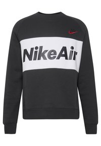 Svart och vit sweatshirt i mjuk bomull med en djärv "NikeAir"-grafik och röd Nike-logotyp på bröstet, med ribbad mudd.