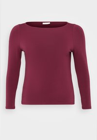 Long-sleeve top in burgundy, made of soft, stretchy fabric. Features a round neckline and fitted silhouette, with a smooth, uniform texture.