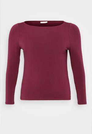 Top cu mâneci lungi de culoare burgund, realizat dintr-un material moale și elastic. Prezintă un decolteu rotund și o siluetă ajustată, cu o textură netedă și uniformă.