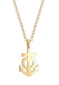 Goldene Halskette mit einem Anhänger in Form eines Ankers, der ein Kreuz- und Herzdesign trägt. Die Kette besteht aus miteinander verbundenen runden Gliedern.