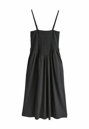 Schwarzes Kleid mit dünnen Trägern, gerafftem Oberteil und fließendem Rock. Hergestellt aus weichem Stoff; mit gesammelten Details und einer A-Linien-Silhouette.