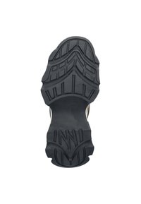 Schwarze Gummisohle mit tiefen Profilen, die ein strukturiertes Muster und Rillen für besseren Halt aufweist. Das Design umfasst ein erhabenes Logo in der Mitte.