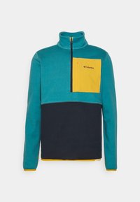 Pull-over in pile color teal e blu navy, con tasca gialla sul petto dotata di zip nera. Collo alto e dettaglio dell'orlo arancione a contrasto.