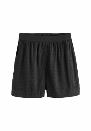 Pantaloni corti neri realizzati in tessuto testurizzato, con vita elastica e tasche laterali, con una vestibilità ampia e orlo semplice.