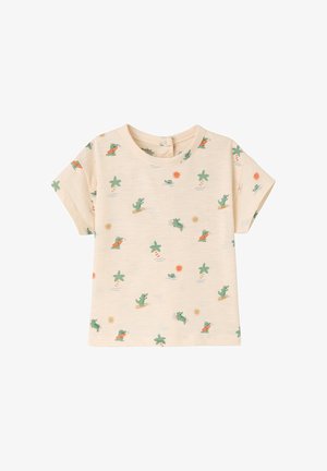 Beige short-sleeve toddler shirt with all-over print of green crocodiles surfing, palm trees, and orange suns.