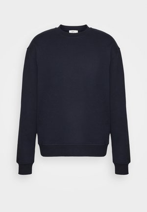 Sudadera azul marino hecha de tela suave. Presenta un escote redondo, manga larga, puños acanalados y un dobladillo recto. Diseño sencillo.