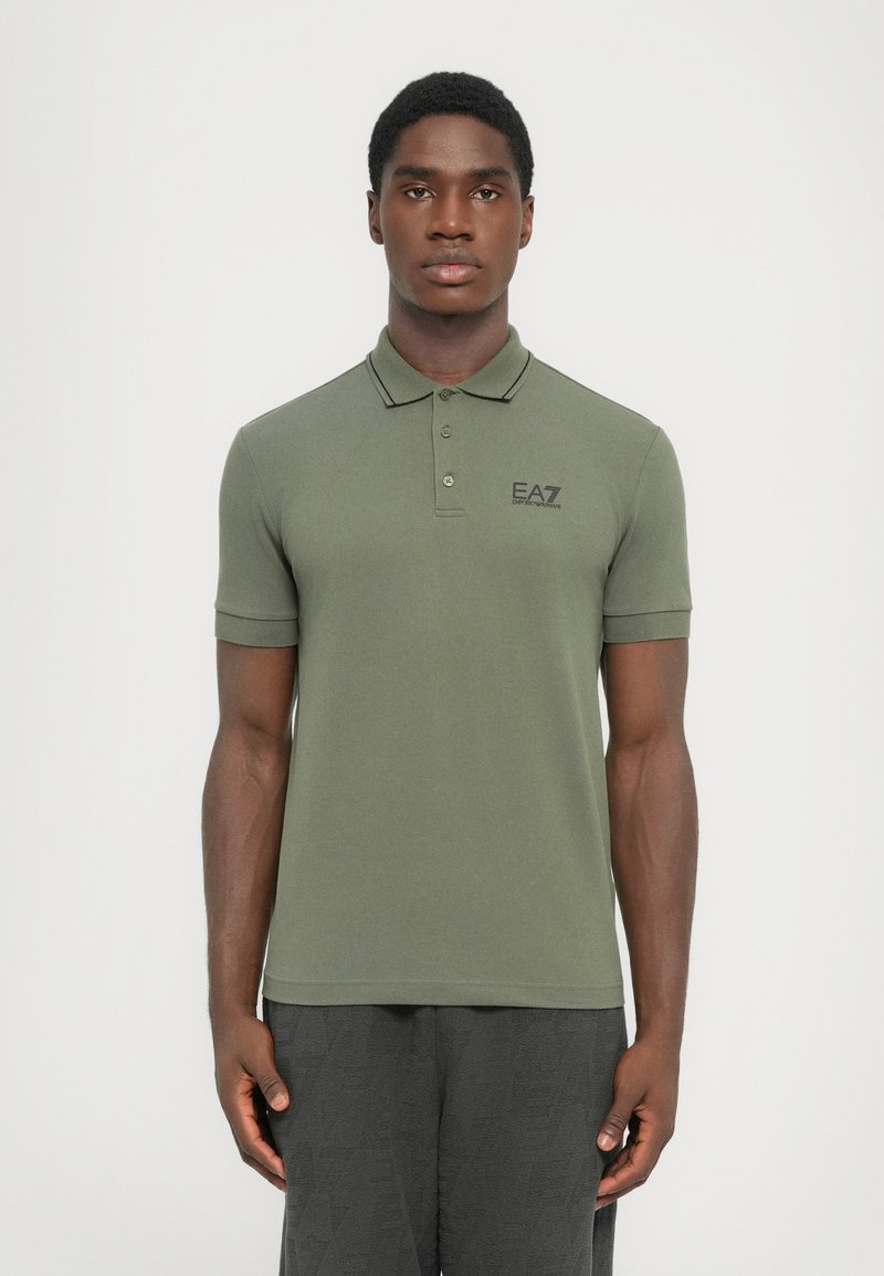 Olive green polo shirt made of cotton, featuring short sleeves, a collar, and a three-button placket. EA7 logo printed on the chest.