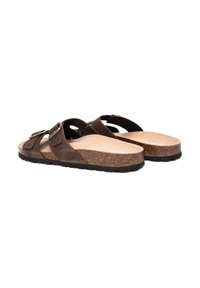 Brown suede sandals with two adjustable straps, cork midsole, and textured rubber outsole. Features a smooth interior finish.