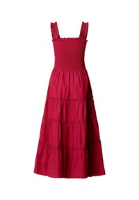 Abito lungo rosso senza maniche con corpetto arricciato, spalline con volants e gonna a balze raccolta.