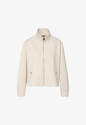 Veste à zip crème avec col montant et deux poches à rabat avec boutons-pression, présentée sur un fond blanc.