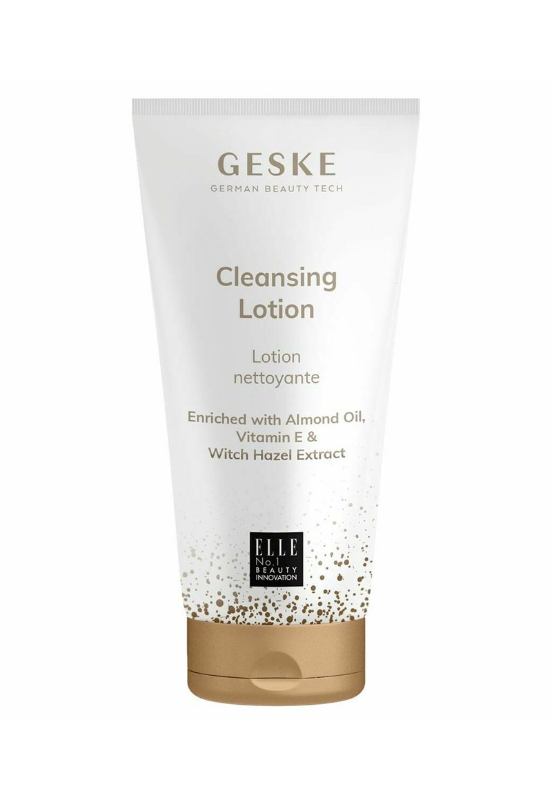 Witte knijptube met gouden accenten, met de tekst "Reinigingslotion", verrijkt met amandelolie, vitamine E en toverhazelaar-extract.