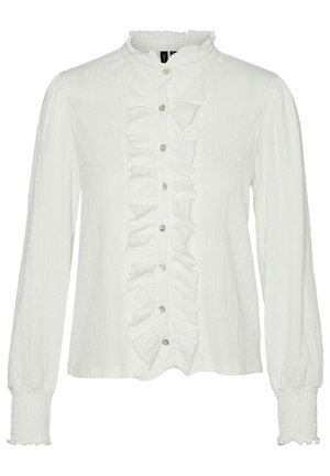 Blouse blanche à manches longues avec patte de boutonnage fronçée à l'avant, petit col montant, poignets élastiques et fermeture boutonnée au centre.