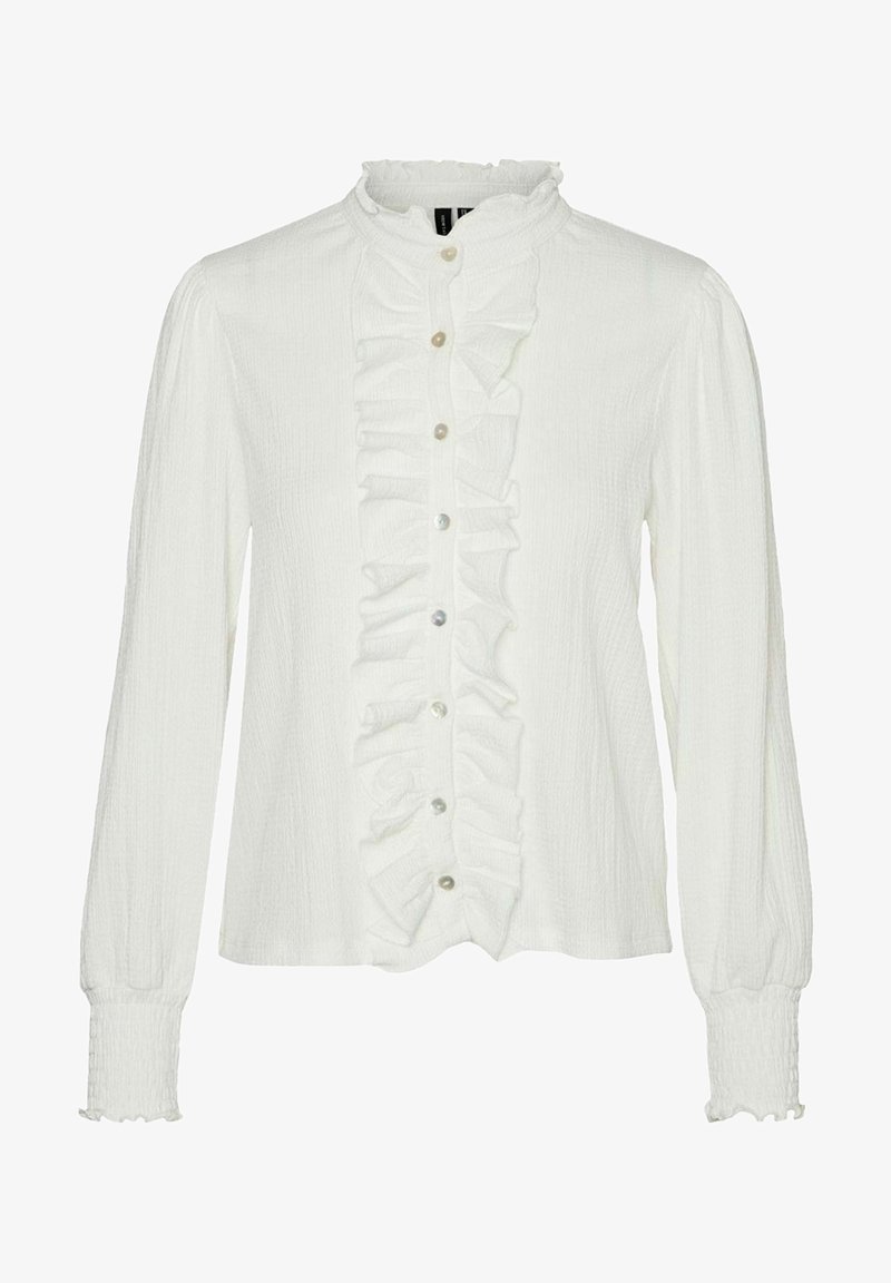 Blouse blanche à manches longues avec patte de boutonnage fronçée à l'avant, petit col montant, poignets élastiques et fermeture boutonnée au centre.