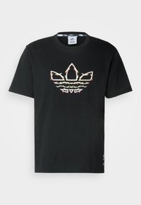 Maglietta nera in cotone con logo grafico multicolore sul davanti. Maniche corte e classico scollo rotondo.