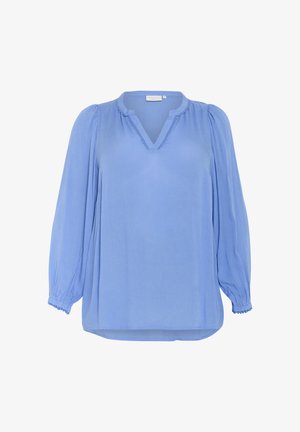 Heled sinine pluus V-kaelusega, pikkade puhvidega varrukatega ja kokkuvõetud randmetega. Valmistatud kerge kangaga, millel on peen tekstuur ja detailid.