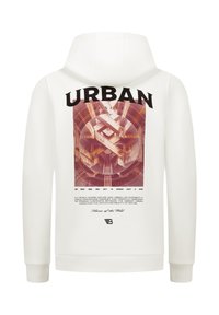 Witte hoodie met een stedelijk architectonisch ontwerp en de tekst "URBAN JUNGLE" op de achterkant, met trappen en geometrische patronen in warme tinten.