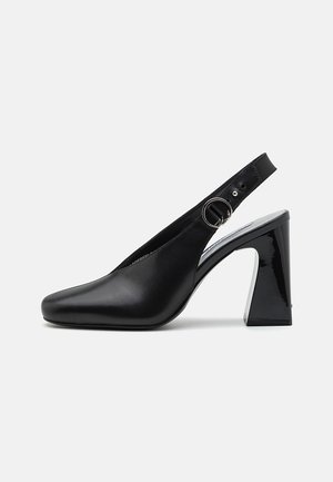 Black slingback high-heeled shoe with a square toe, patent finish, and a metal ring accent on the strap. Textured leather upper.