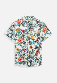 Chemise à manches courtes à motif floral, avec un fond blanc et des fleurs colorées vives accompagnées de feuilles vertes, fabriquée en tissu léger.