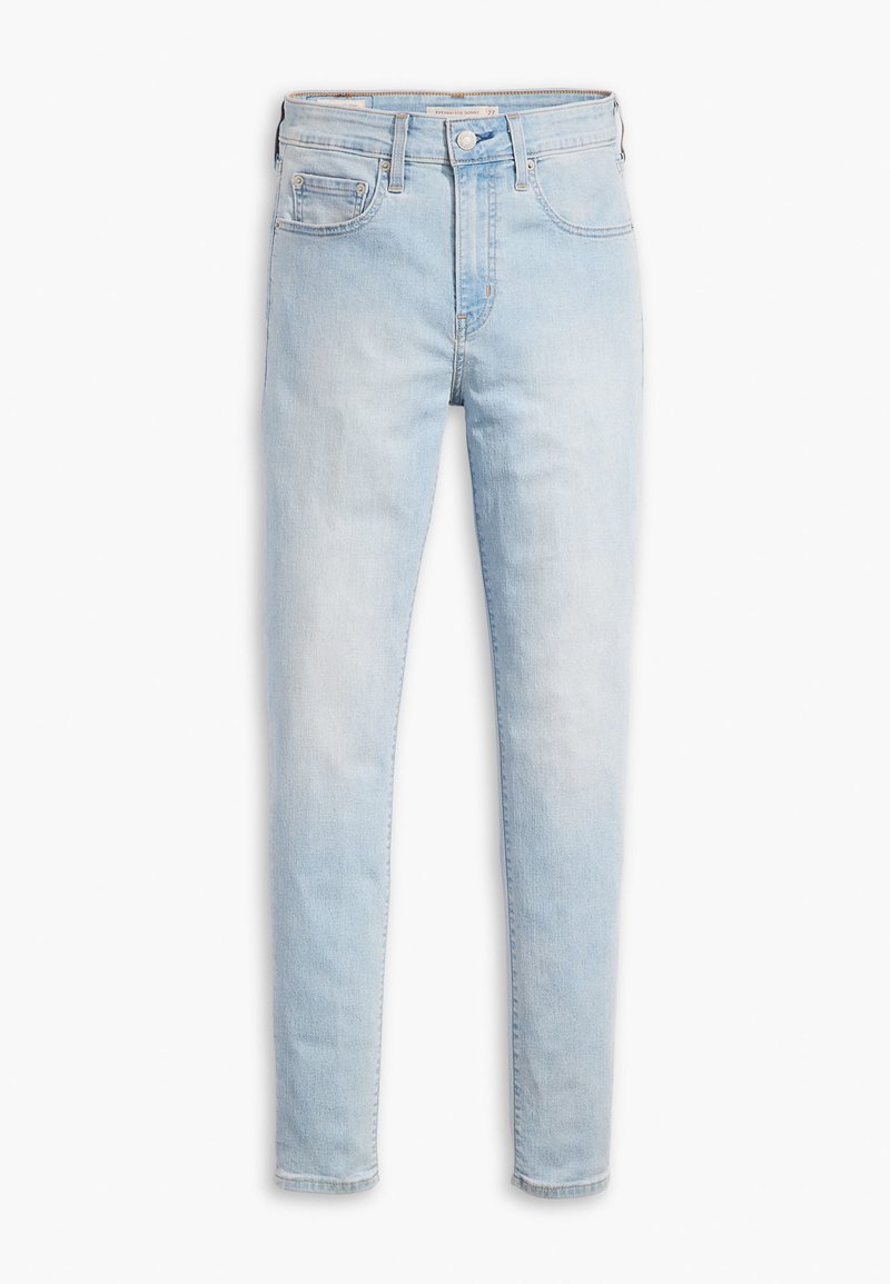 Jeans en denim bleu clair avec une coupe slim. Présente une taille haute, cinq poches et une fermeture classique à bouton et à zip. Texture lisse.