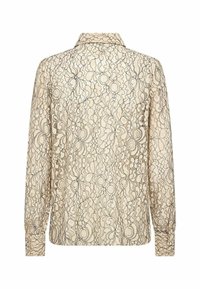 Lace blouse in beige with a floral pattern, button-down collar, and long sleeves. Textured design features intricate black detailing.