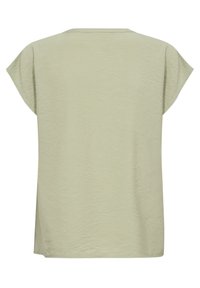 Blusa corta a maniche corte verde chiaro, con una vestibilità rilassata e un design a coste, caratterizzata da un collo rotondo e un orlo dritto.
