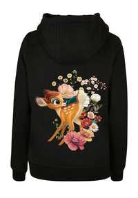 Felpa nera con un'illustrazione colorata di un cervo circondato da vari fiori, che mette in risalto il tessuto morbido e un design rilassato.