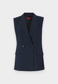 Marineblå ärmløs blazer med doble knapper, frontlommer og skarpe revers. Glatt stoff med subtil glans og logomerking.
