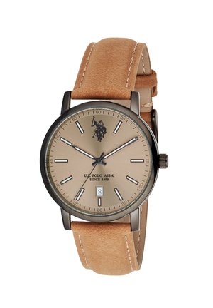 Orologio rotondo beige U.S. Polo Assn. con cassa in metallo nero, cinturino in pelle beige, indicatori minimalisti, tre lancette e display della data alle 6.
